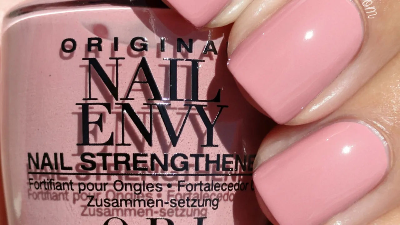 Two mint chocolate milkshakes with whipped cream and green sprinkles.