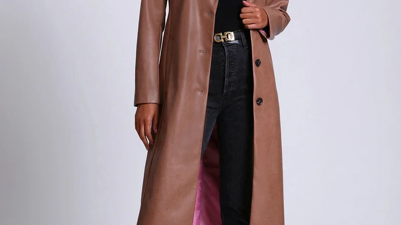 Close up on a plate of mashed potatoes, topped with baked pork chops with cream of mushroom soup, and a side of green beans.