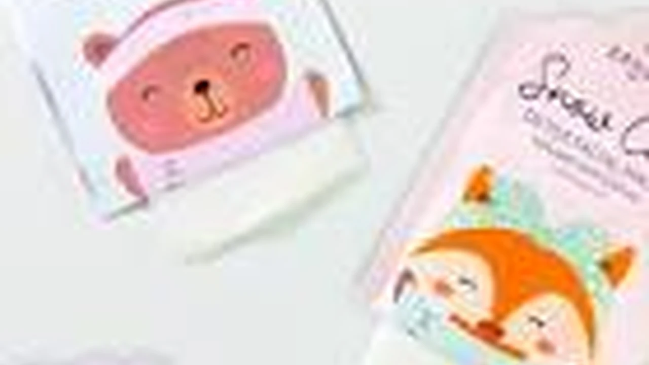 blue bowl of black bean beef tortilla soup on a board with cilantro and shredded cheese in background