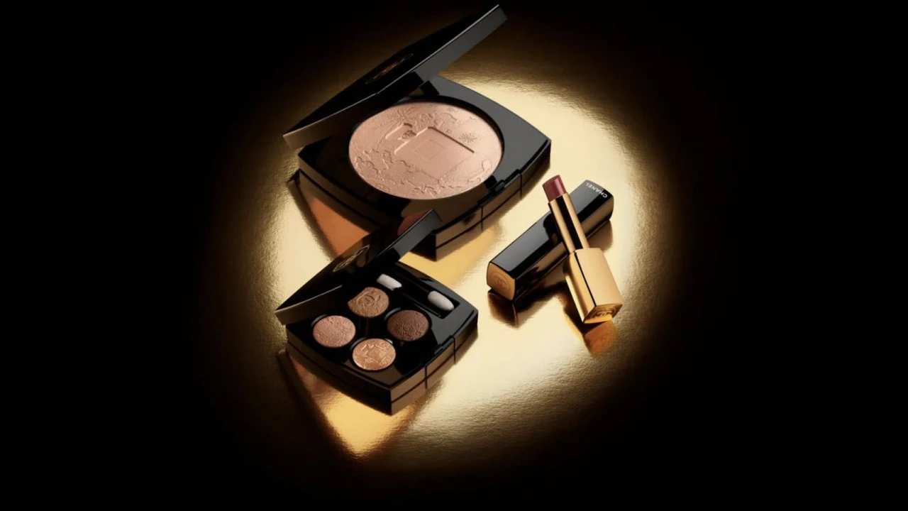 blue bowl of black bean beef tortilla soup on a board with cilantro and shredded cheese in background