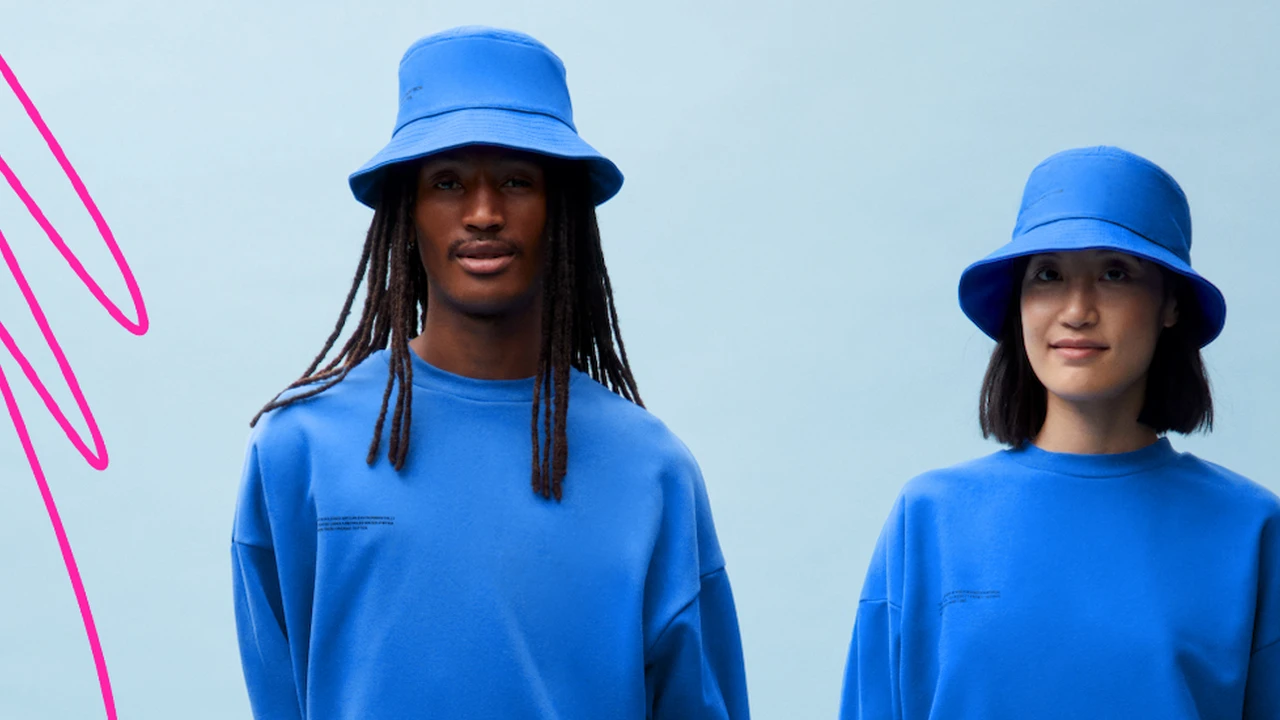 Close up on a plate of mashed potatoes, topped with baked pork chops with cream of mushroom soup, and a side of green beans.